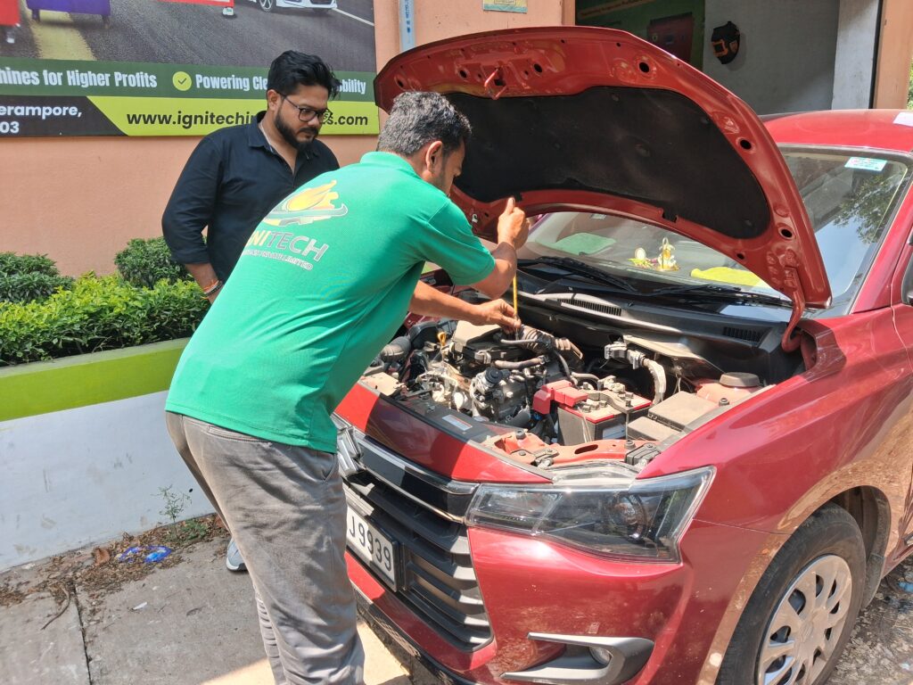 Worker opening a car hood for inspection and maintenance at an auto service center